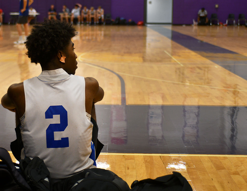Limestone High School's Jalen Sanders watches his team from the sidelines